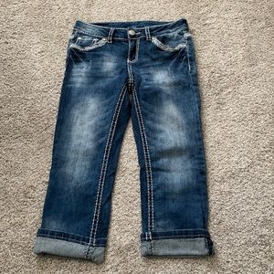 Blue Jean capris w/fancy detail trim.